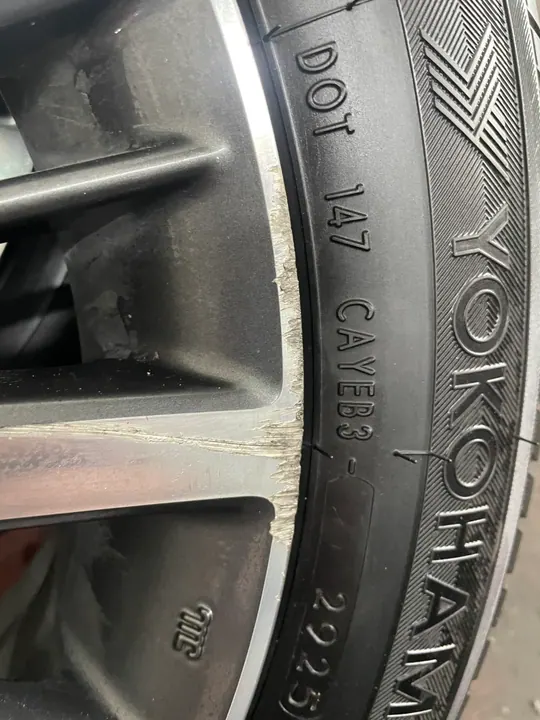 Before repair curb rash on alloy wheel lip